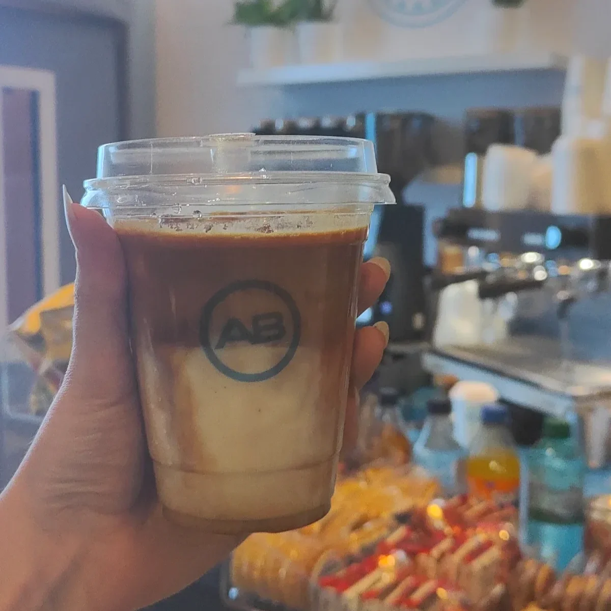 Assorted iced coffee drinks served from a mobile coffee bar at an event.