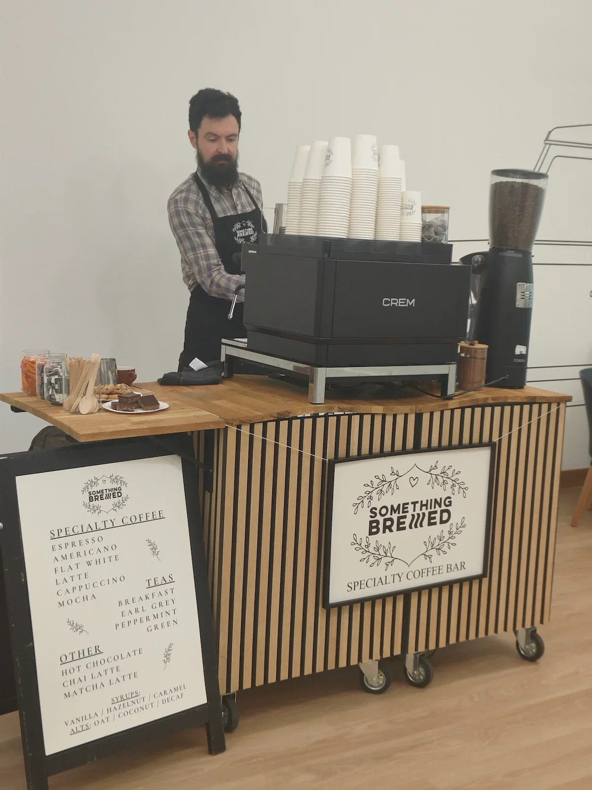 Professional mobile coffee bar setup serving guests at a corporate event in Scotland.