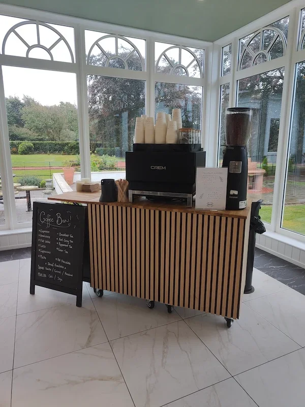 Styled wedding coffee bar setup with signage and equipment