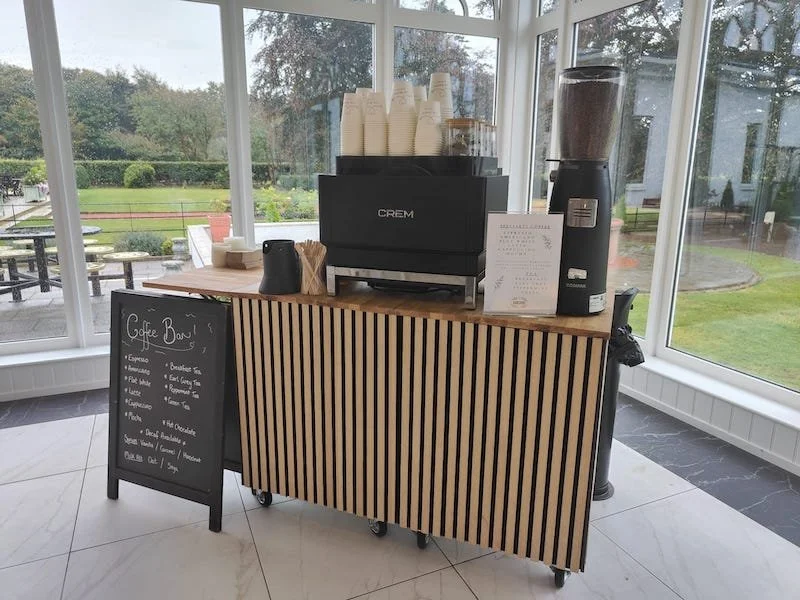 Full mobile coffee bar view with latte art equipment