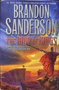 Book cover of "The City of Kings" by Brandon Sanderson, featuring a fantasy scene with a figure in a red cloak standing on a rocky cliff at sunset.