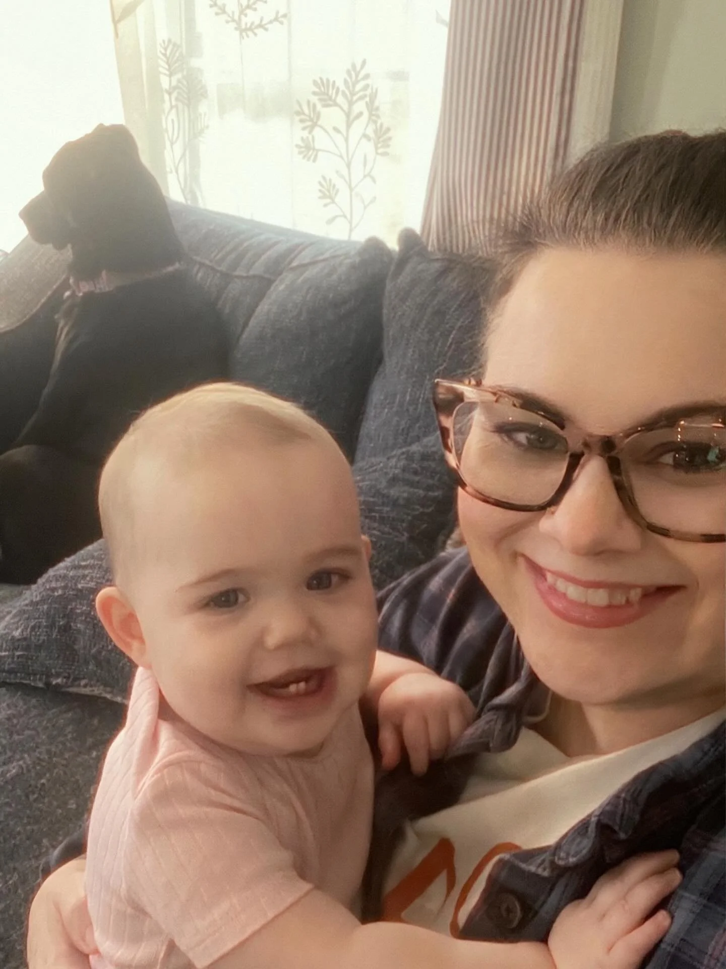 Holding onto Mam for dear life because we&rsquo;re afraid of the T Fiber install guy. Looking at herself in the camera is getting a smile though. Sallie is embarrassed by the whole thing and pretending not to know us 🐕&zwj;🦺