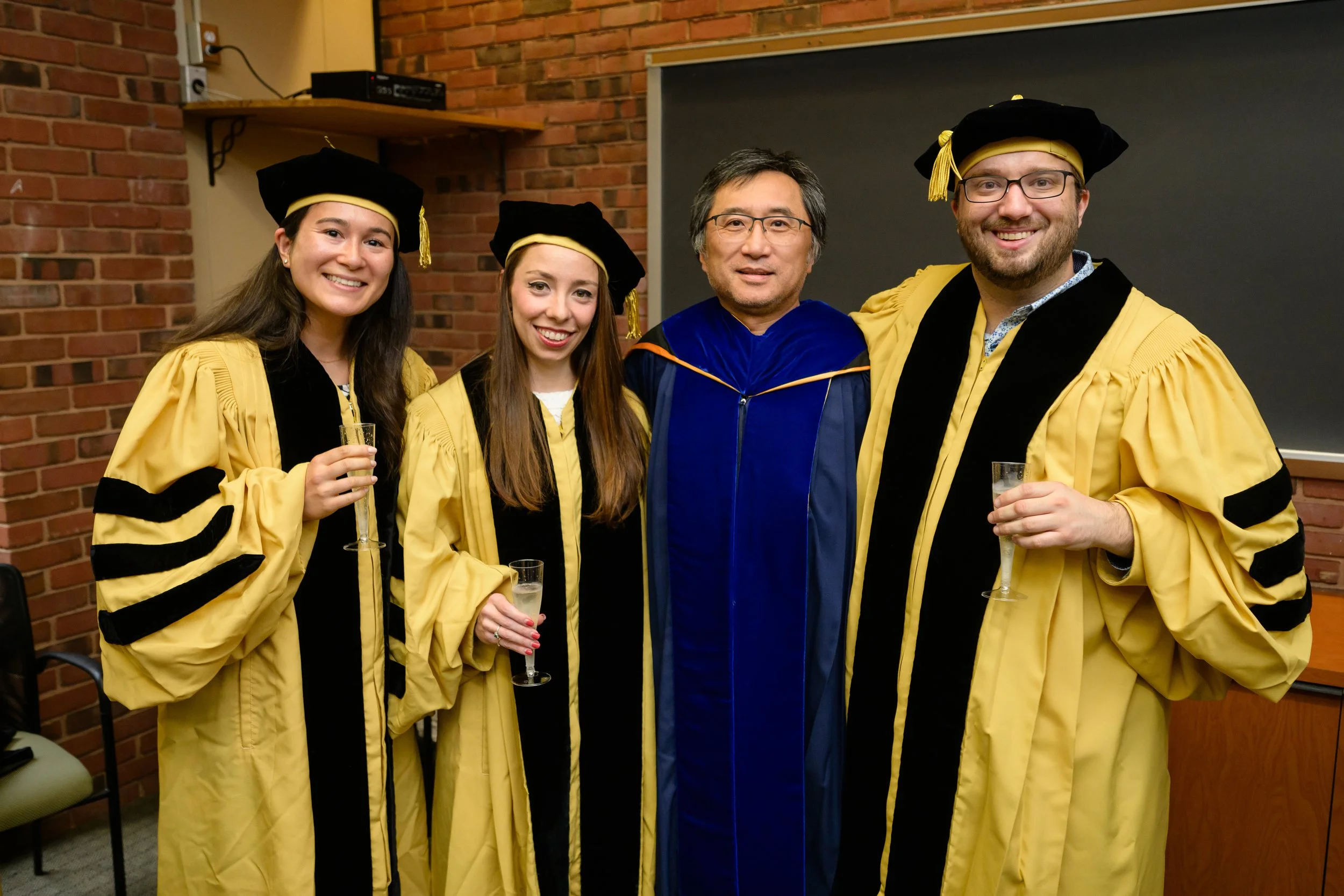 May 23rd, 2024: Kim Lab graduates Margaret Starostik (left), Jessie Kirshner (middle), and Nathan Roach (right) at JHU CMDB's Hooding Ceremony. Congrats Drs. Starostik, Kirshner, and Roach!