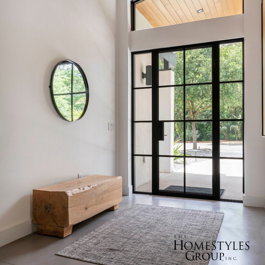 Walk into a world illuminated by natural light with our modern and sleek entrance design! The glass door and the strategically placed window above it allow the sun's rays to dance through, creating a bright and welcoming atmosphere. Imagine this dail