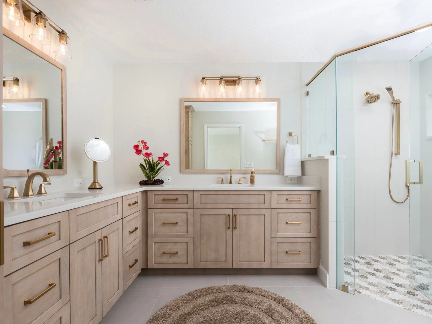 Your bathroom should feel like a retreat and this remodel was created with that in mind.

We updated this space with custom storage, warm gold fixtures, a bright walk-in shower, and finishes that feel both modern and timeless.

For homeowners looking