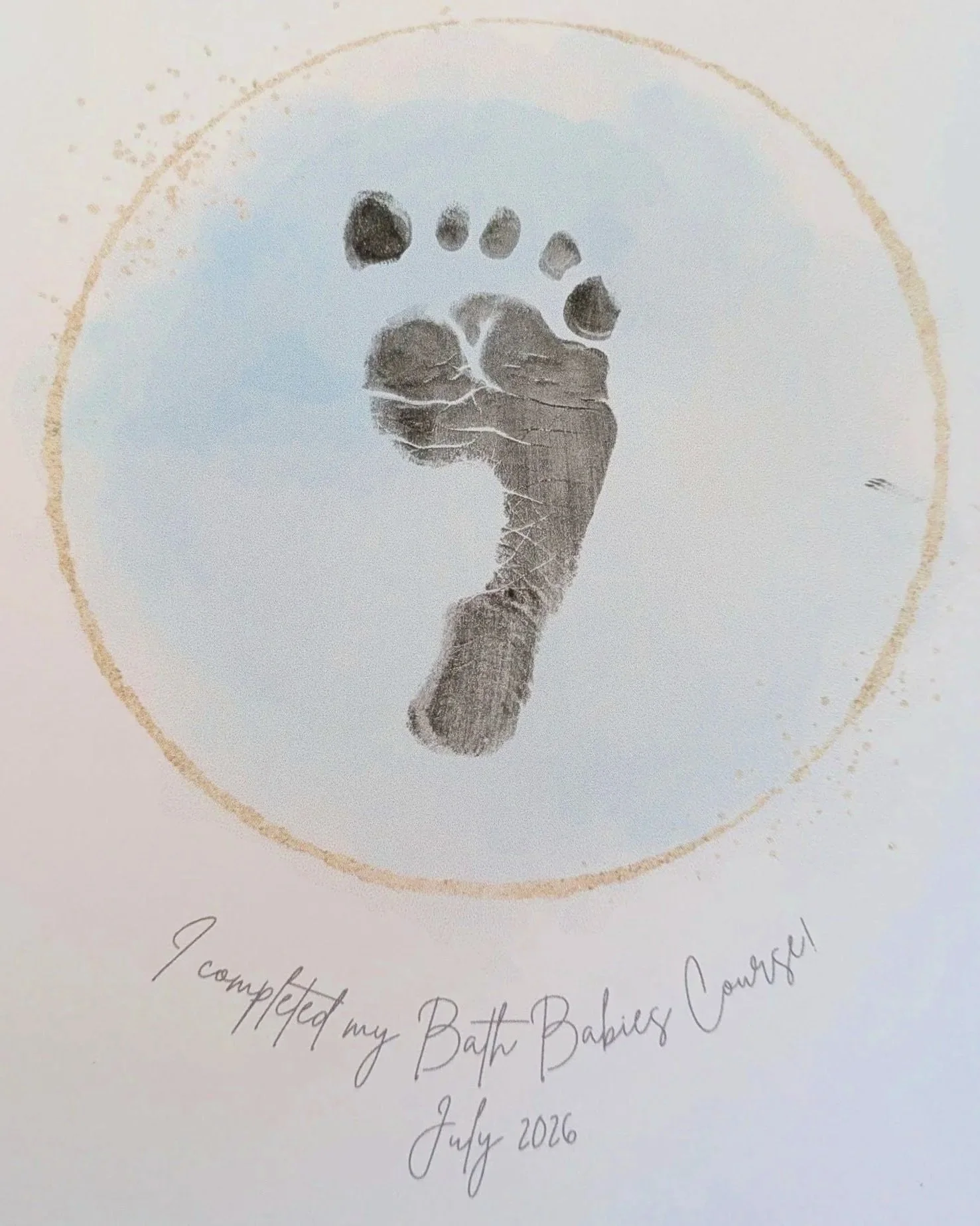 A baby's footprint on a course completion certificate