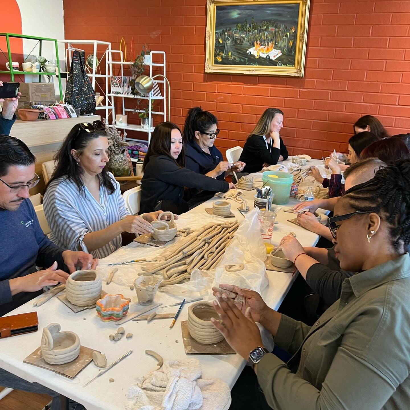 Hosted a large corporate event yesterday of 40+ people! We split the group into three smaller groups and put them on 3 rotating stations&mdash;handbuilding where they all made coil pots, wheel-throwing where they each made a piece on the pottery whee