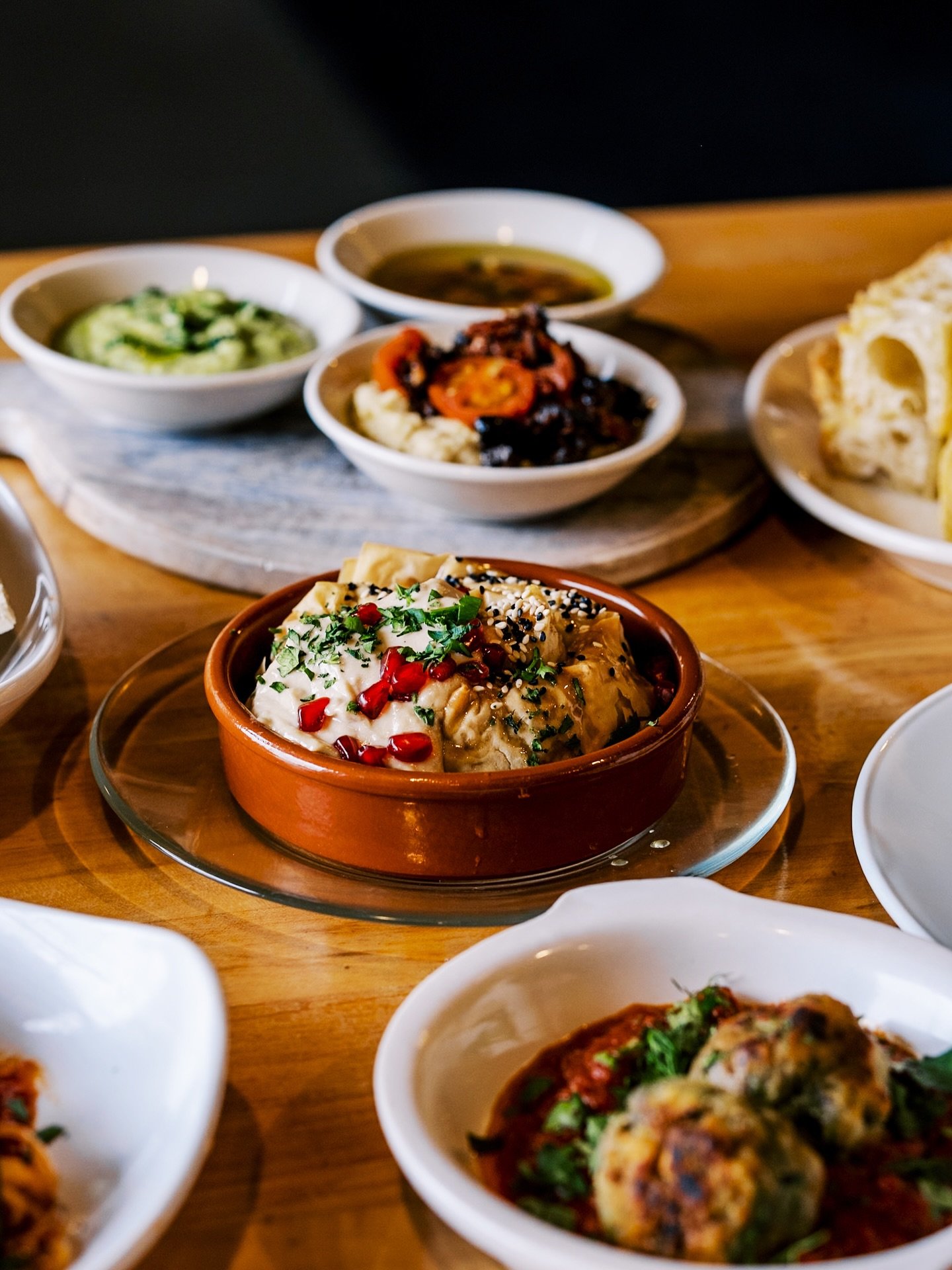 Boureka
phyllo | maitake | spinach | tamarind | soy-bay syrup
 
This dish blurs the line between boureka and baklava. It's filled with maitake and oyster mushrooms, spinach, and tamarind. Topped with Nigella seeds and sesame seeds. As it comes out of