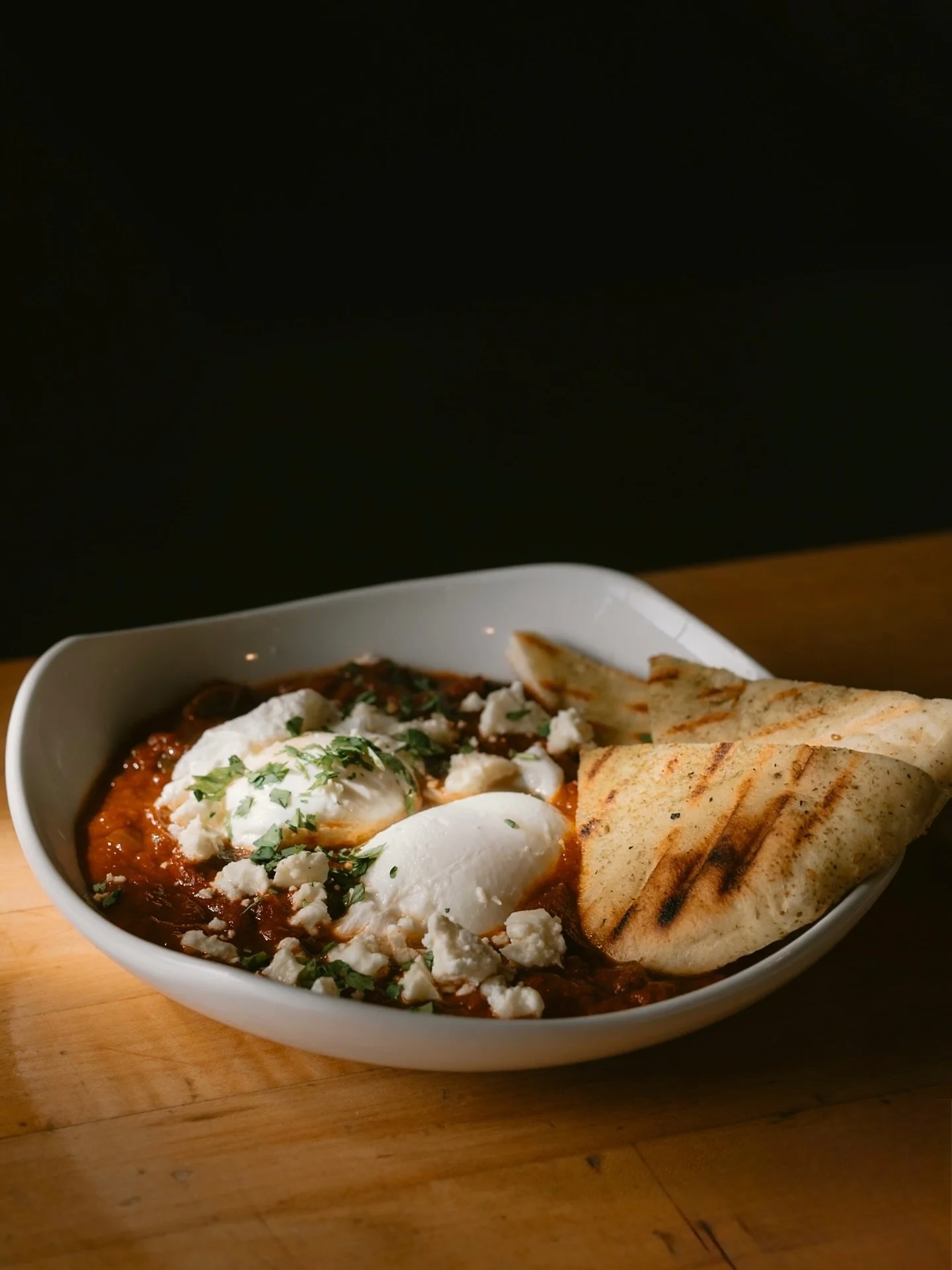 Shakshuka
poached eggs | feta | flatbread

Using the Zahav recipe, we introduced this shakshuka at our brunch Second Saturday and decided to make it a fall menu staple.
Vegan option available