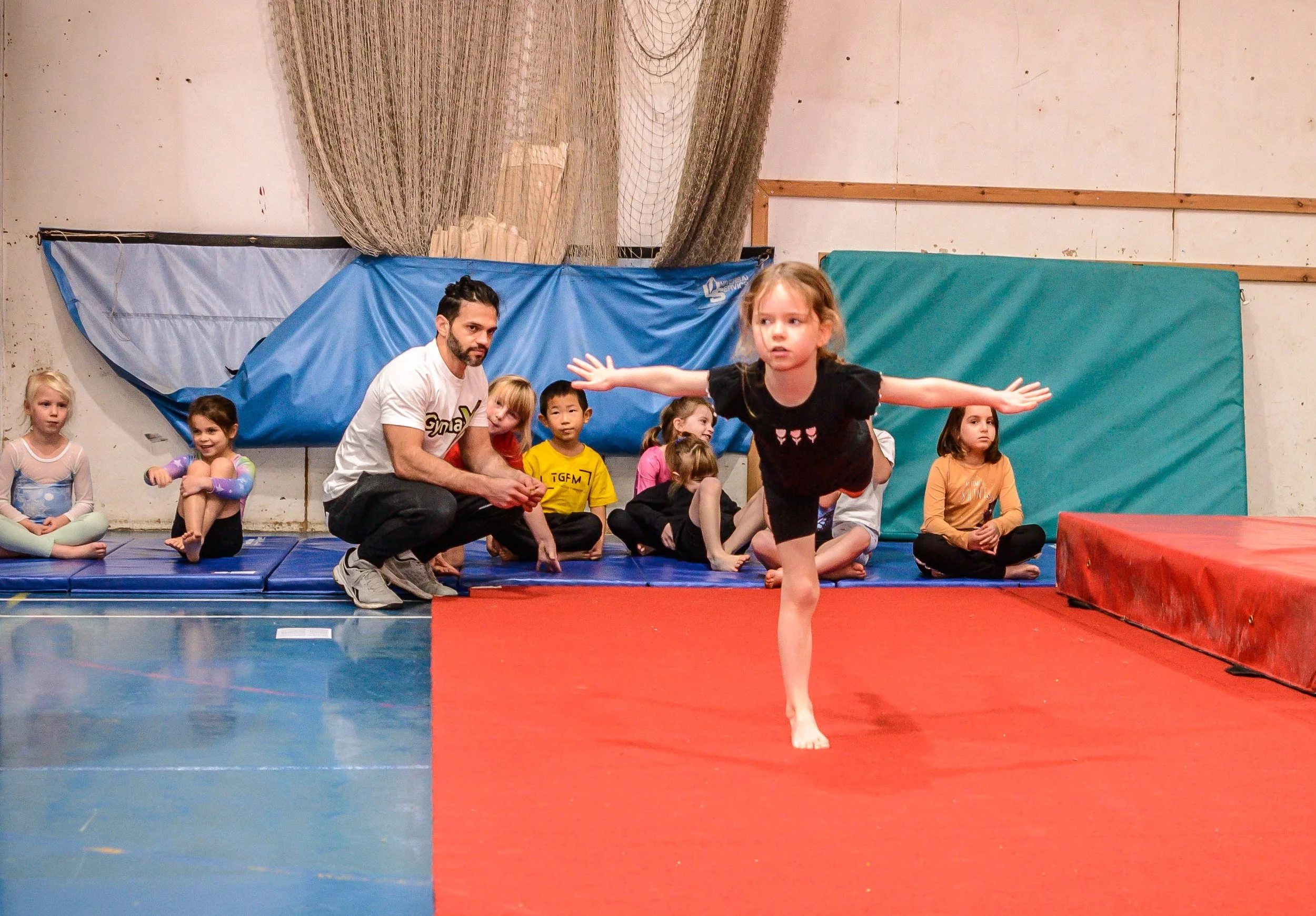 Children competing in GymnaX Games gymnastics event at Cumnor House Sussex