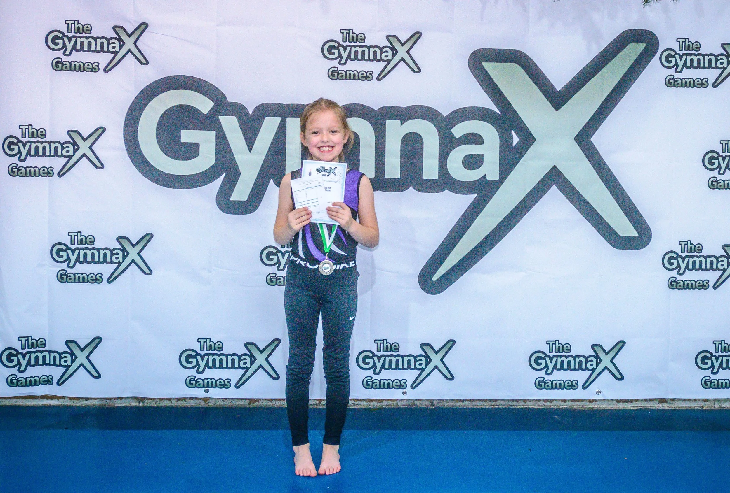 Children competing in GymnaX Games gymnastics event at Cumnor House Sussex