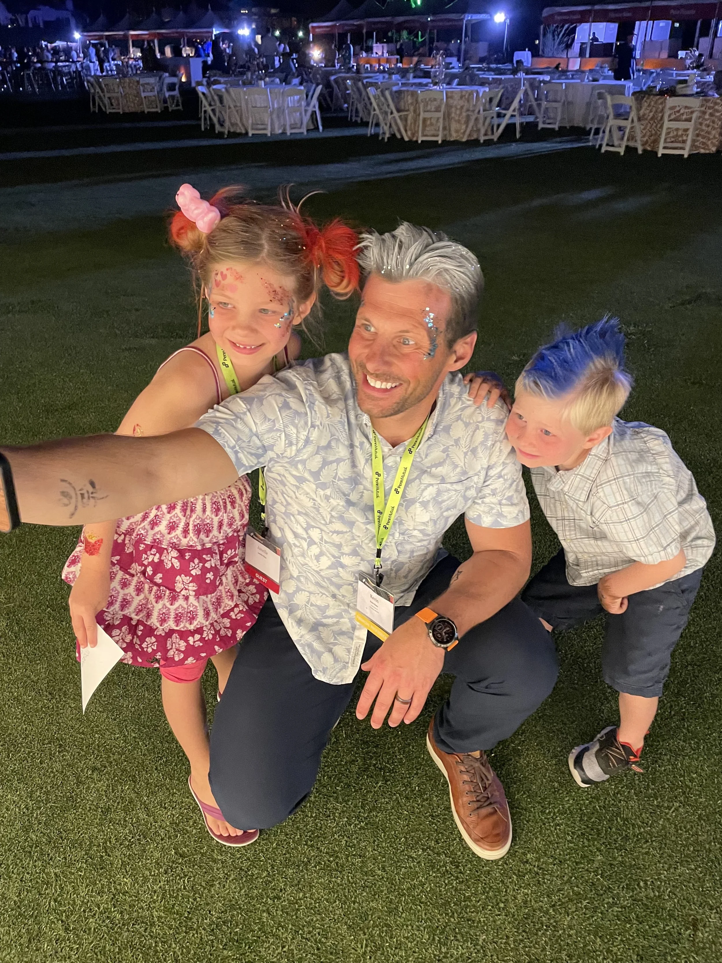 dad taking selfie with kids