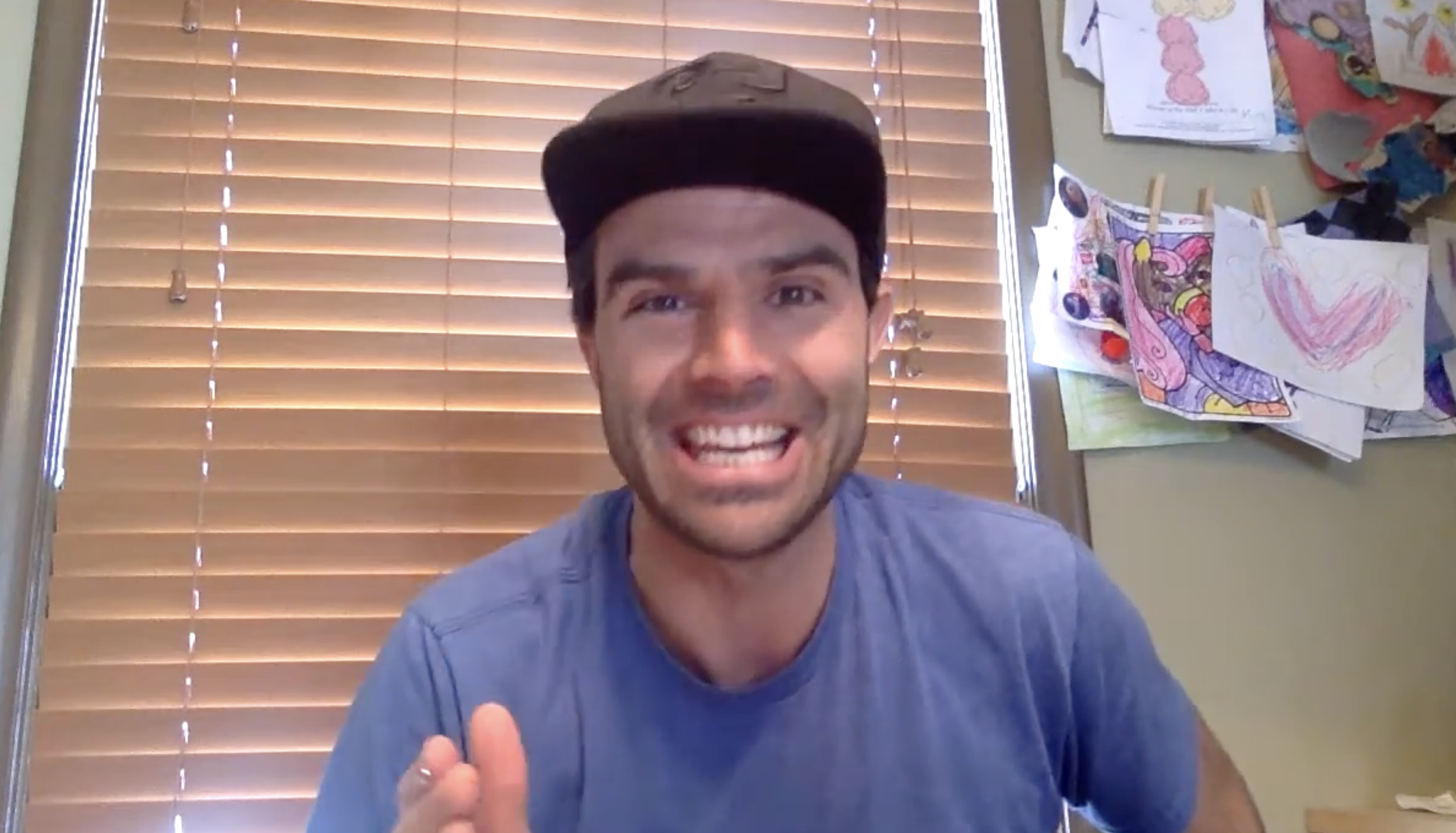 man smiling and talking to computer