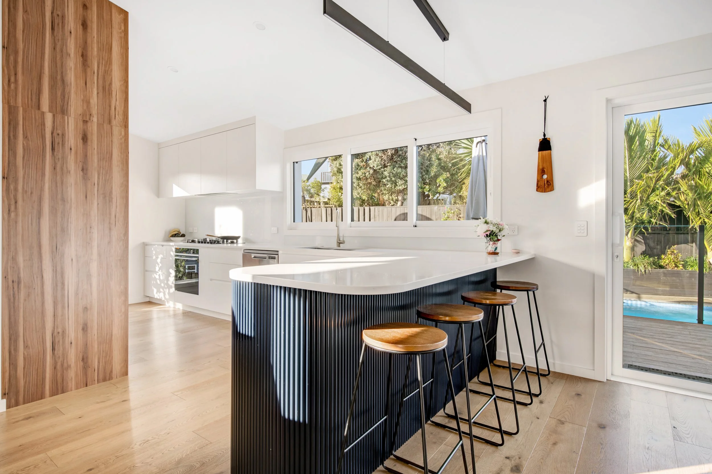 Interior design service for residential and commercial. Kitch design with contrasting colours and textures, capturing views and natural light.