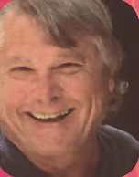 Close-up of an elderly man smiling with gray hair