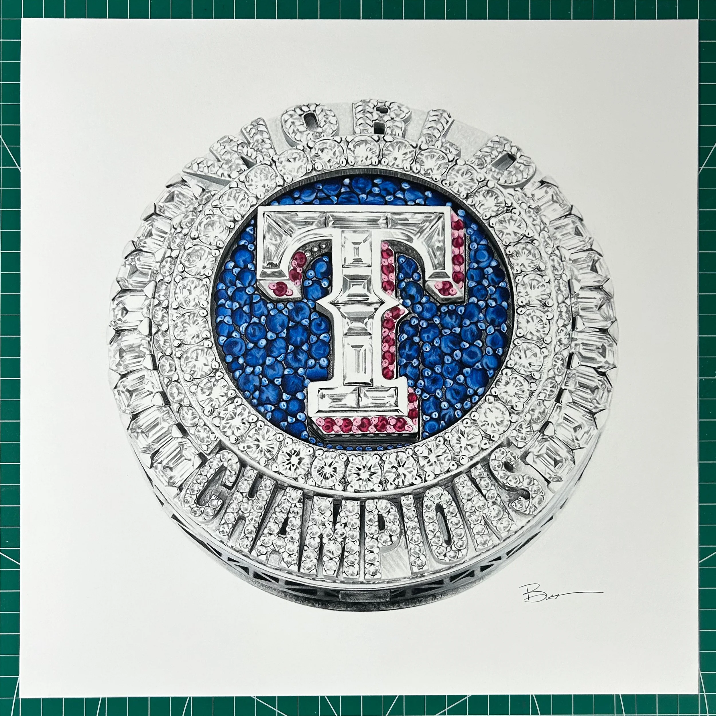 Close-up of a jewelry piece featuring a large, circular, diamond-encrusted design with the Texas Rangers logo in the center, surrounded by the words "TEXAS RANGERS" also in diamonds.