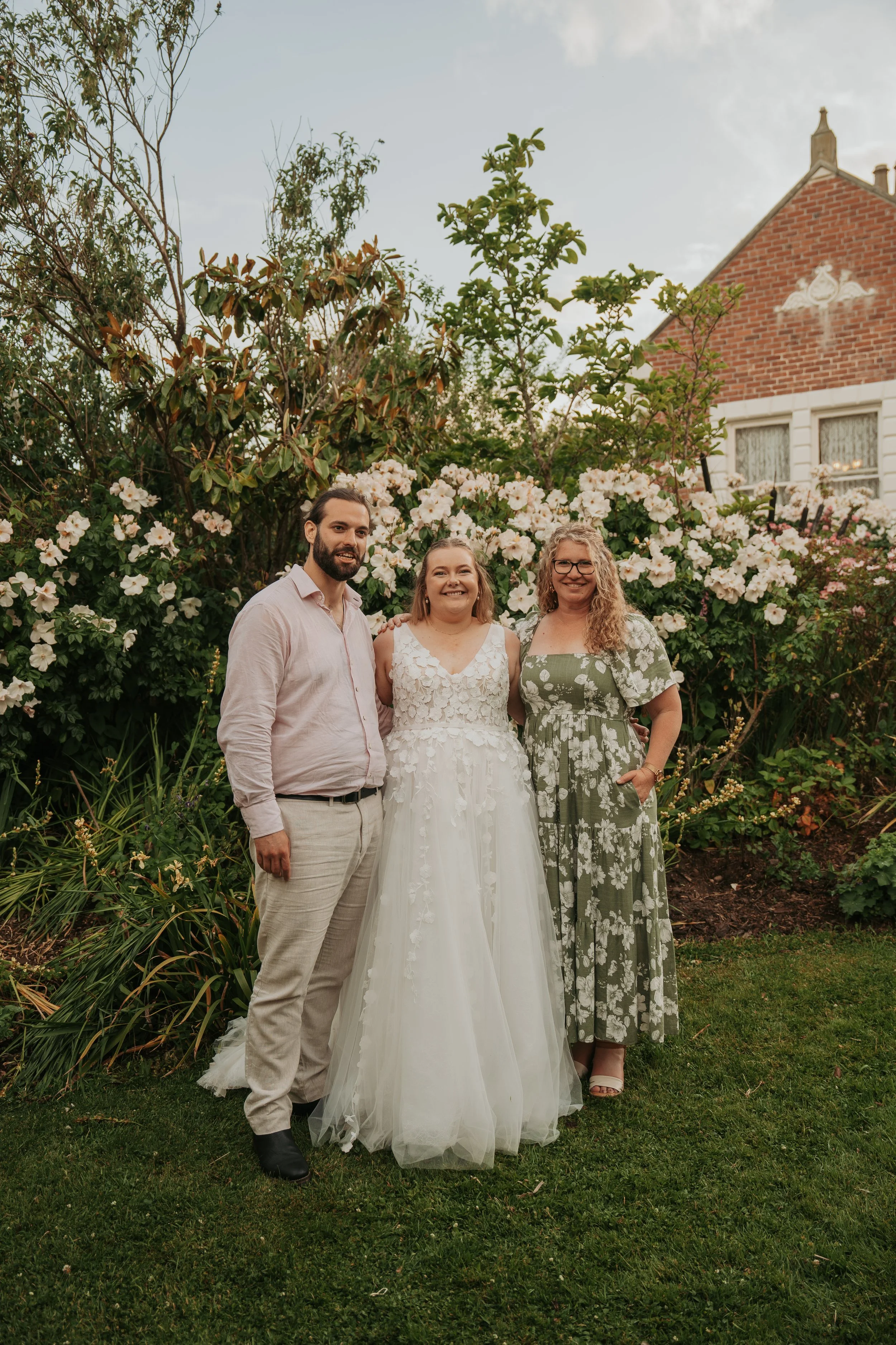 Celebrant and MC based in Dunedin standing with couple from Milton at venue in Balclutha creating friendly and fun, relaxed personalised weddings and as MC helping everyone celebrate at the reception