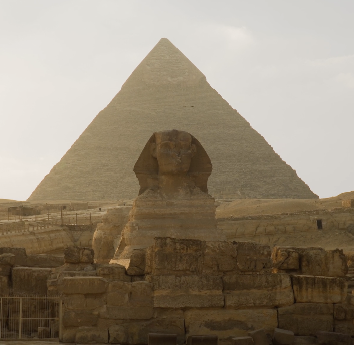 Sphinx of Giza with pyramid in the background