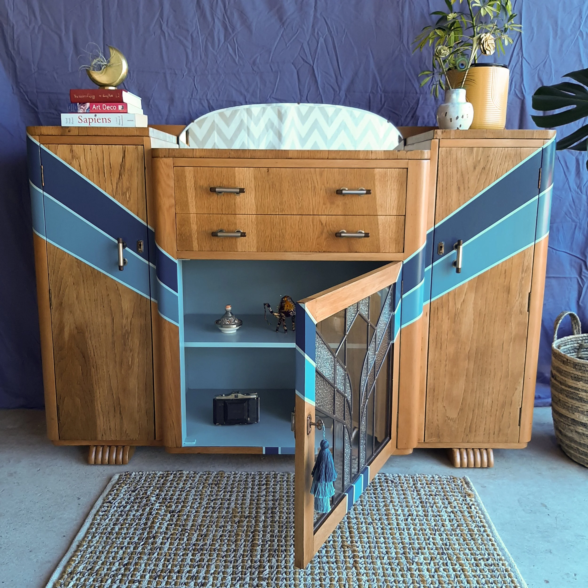 Upcycled art deco sideboard cabinet with mirror and a new customised leadlight front designed and made by me. Built new leadlight panel for the front middle cabinet, sanded off old shellac, painted new design, varnished