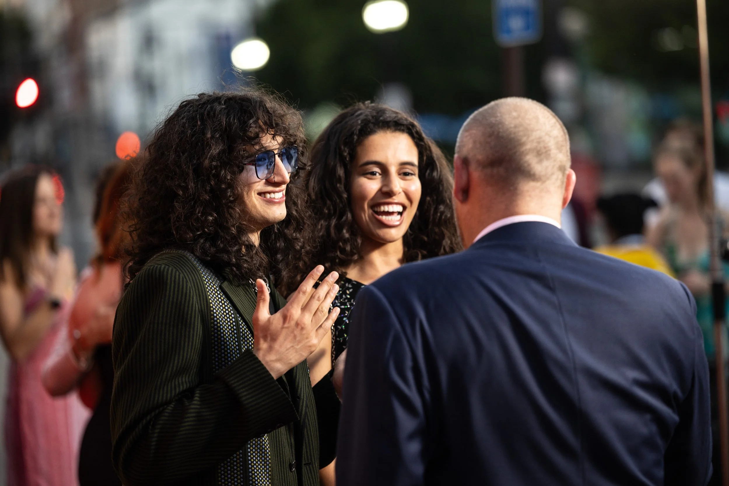 A filmmaker couple smiling and getting interviewed on the Cindependent red carpet