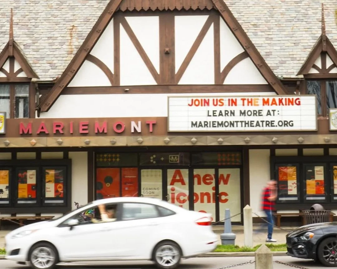 Mariemont Theatre entrance with windows covered in promo for Cindependent. Marquee says "Join us in the Making. Learn more at mariemonttheatre.org". Image links to theatre Instagram.