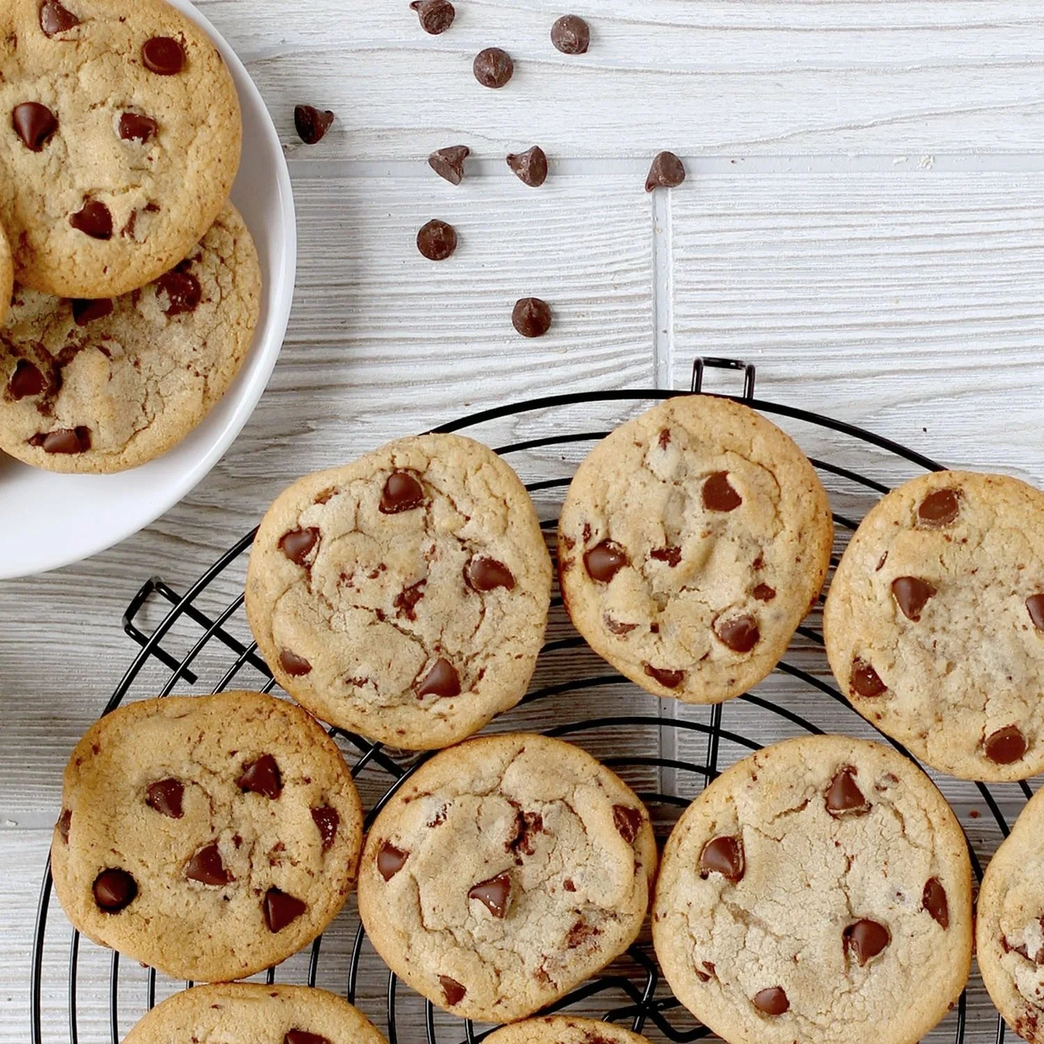 A cooling tray with Chocolate Chip cookies on it