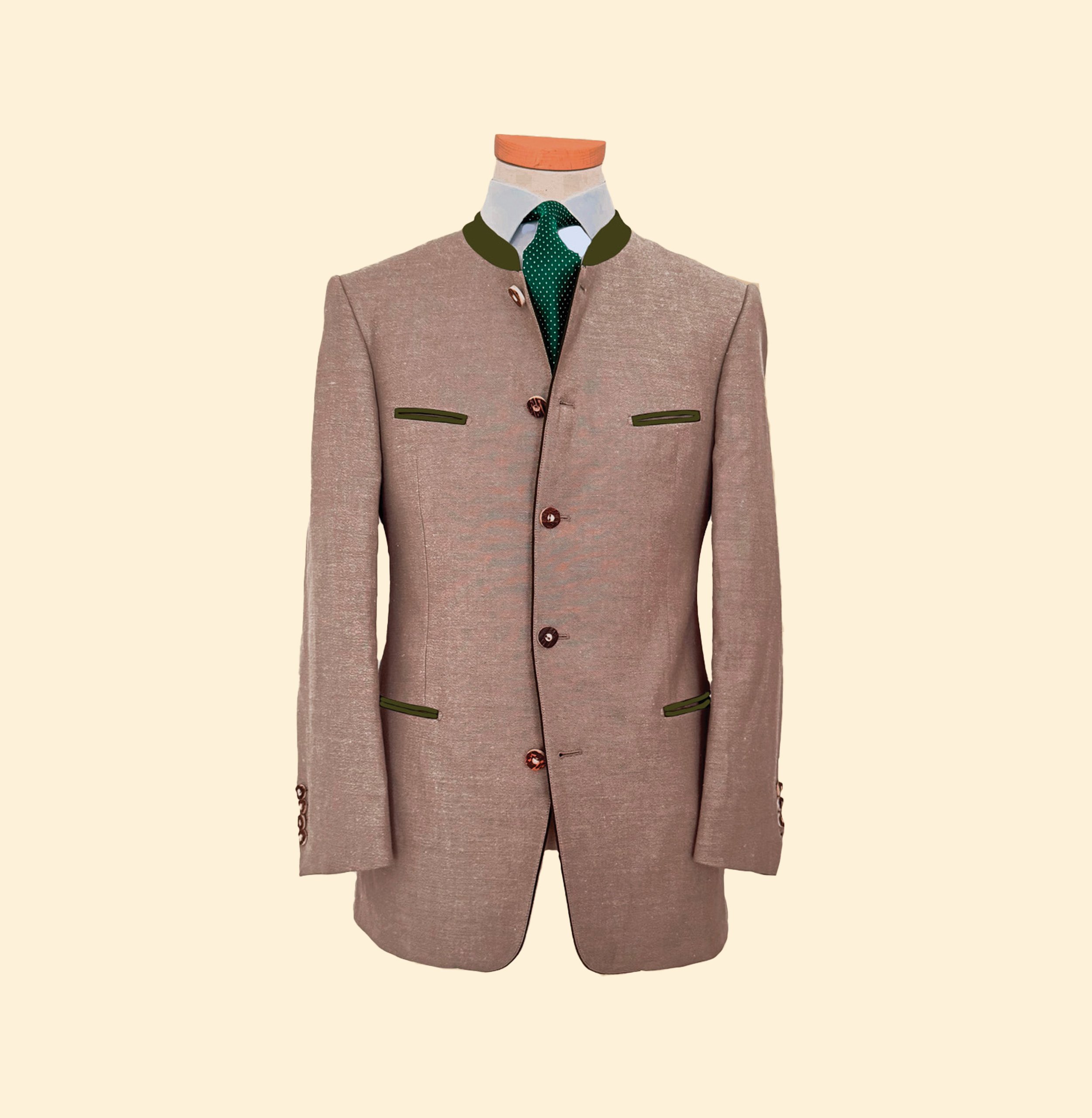 Veste masculine en tissu beige avec boutons ajustés, motif traditionnel, avec chemise blanche, cravate verte à pois, fond beige clair.