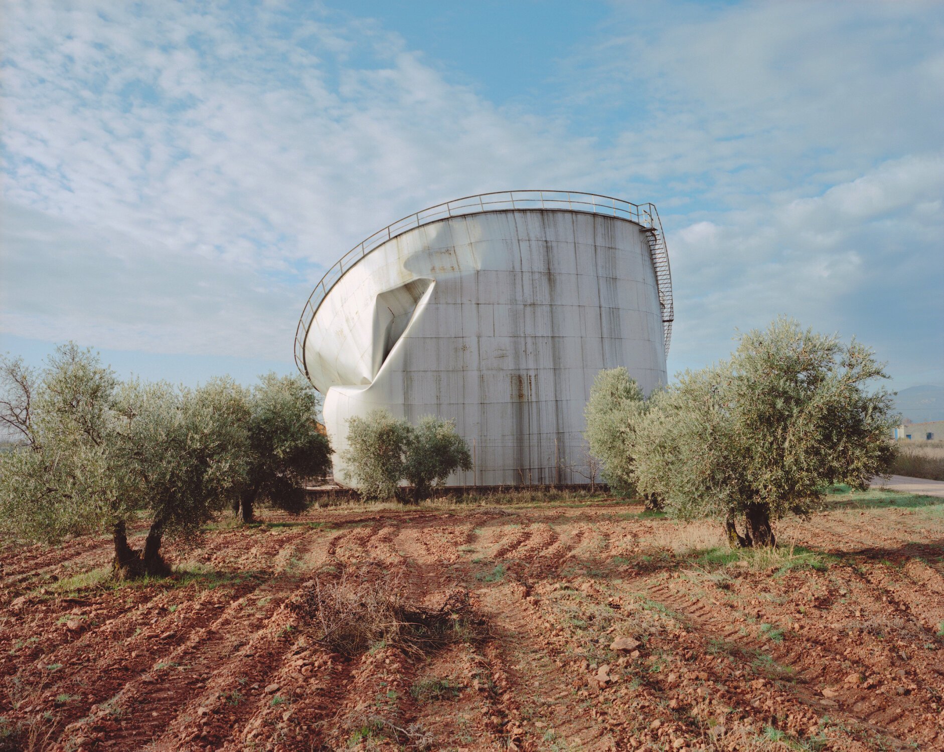 “Tank and olive trees, La Mancha” from the series Country Fictions by Juan Aballe | Mamiya 7, Kodak Portra Film