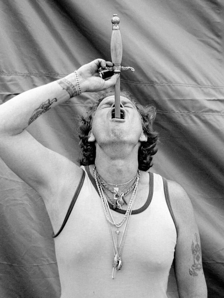  This is “Red” the sword swallower. The first time I ever tried Moonshine was with Red, late, after hours in the closed carnival. It packs a punch. 
