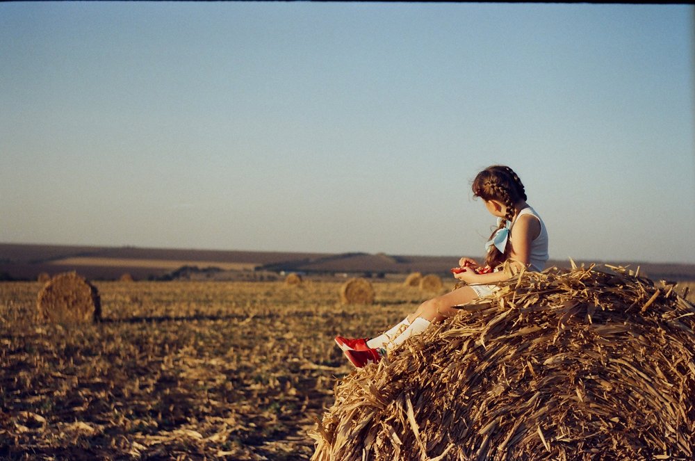 "A girl waiting for her farmer father" by Alina Saffron