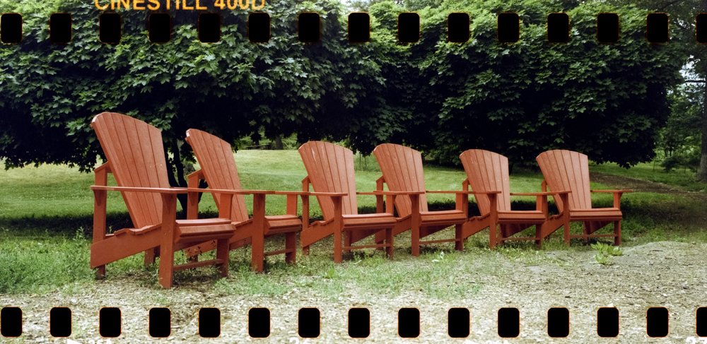 "Five Red Adorondak Chairs" by Adam James