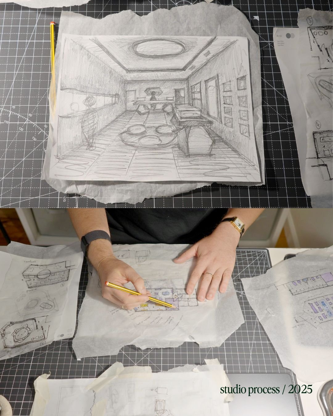 Artist working on sketches of an interior room design, with a detailed drawing of a living space featuring furniture, framed pictures, and a circular ceiling light, on a work surface with multiple sketches and plans.