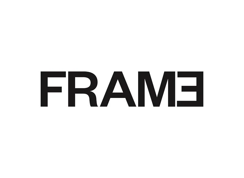 The word 'FRAME' in black text, flipped horizontally on a white background.