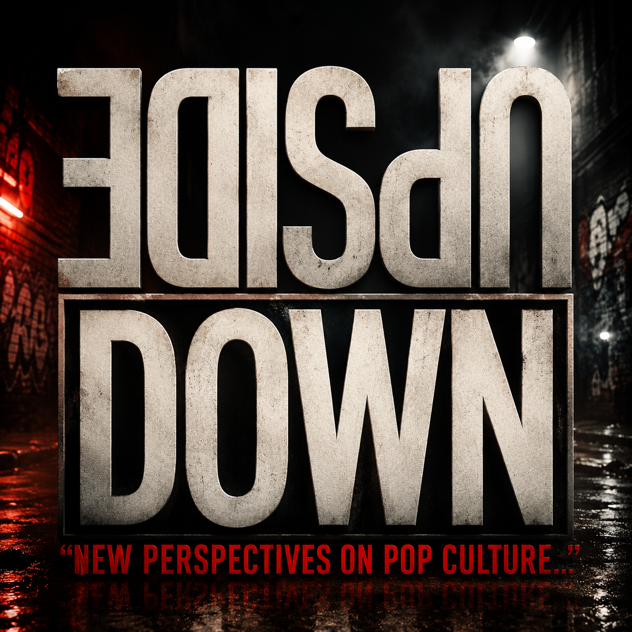 Bold black and white graphic with the words 'UP SIDE DOWN' flipped upside down, and a subtitle in red reading 'New perspectives on pop culture'.