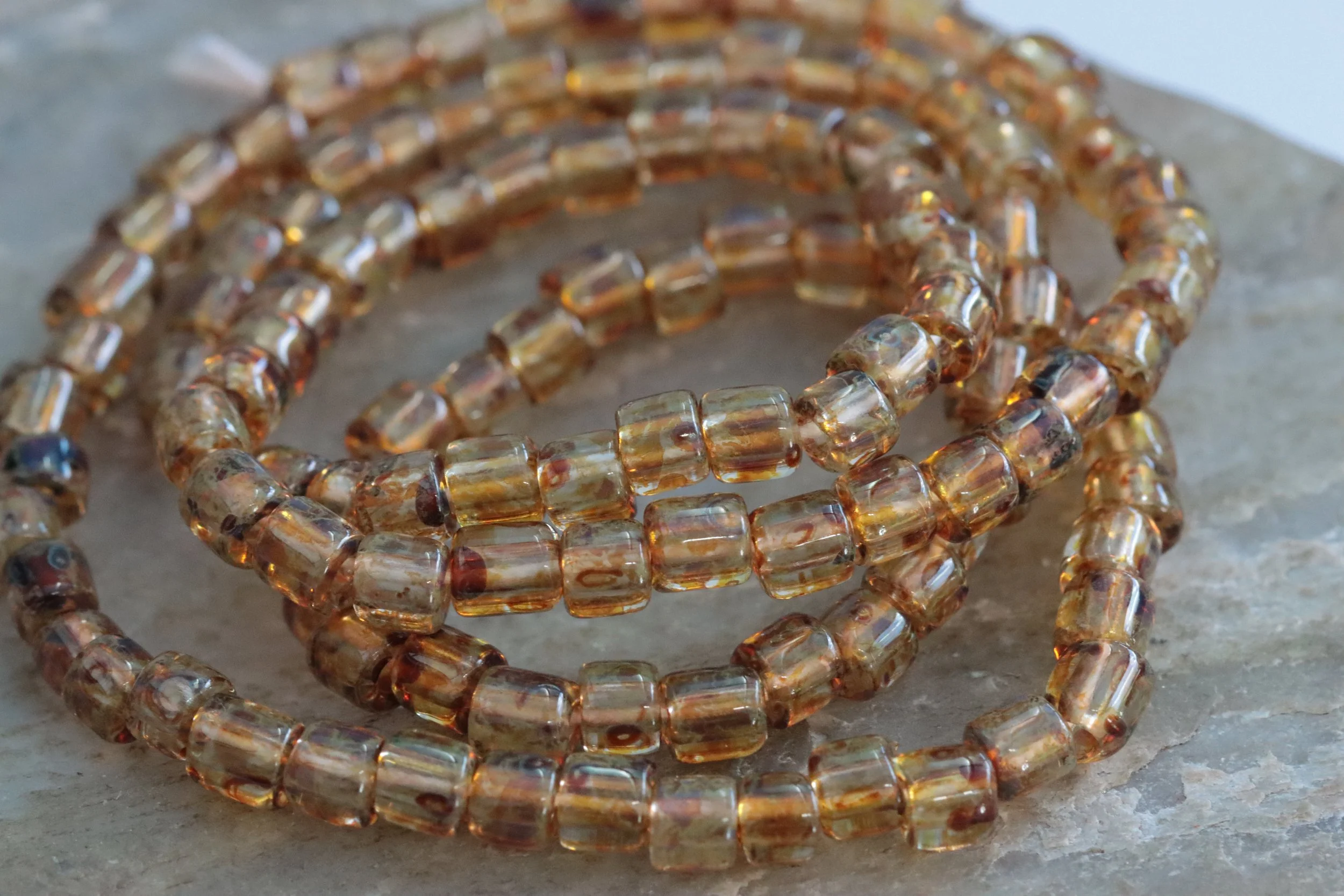 Aged Picasso Czech Glass Bugle Beads: 6/0 Brown Topaz