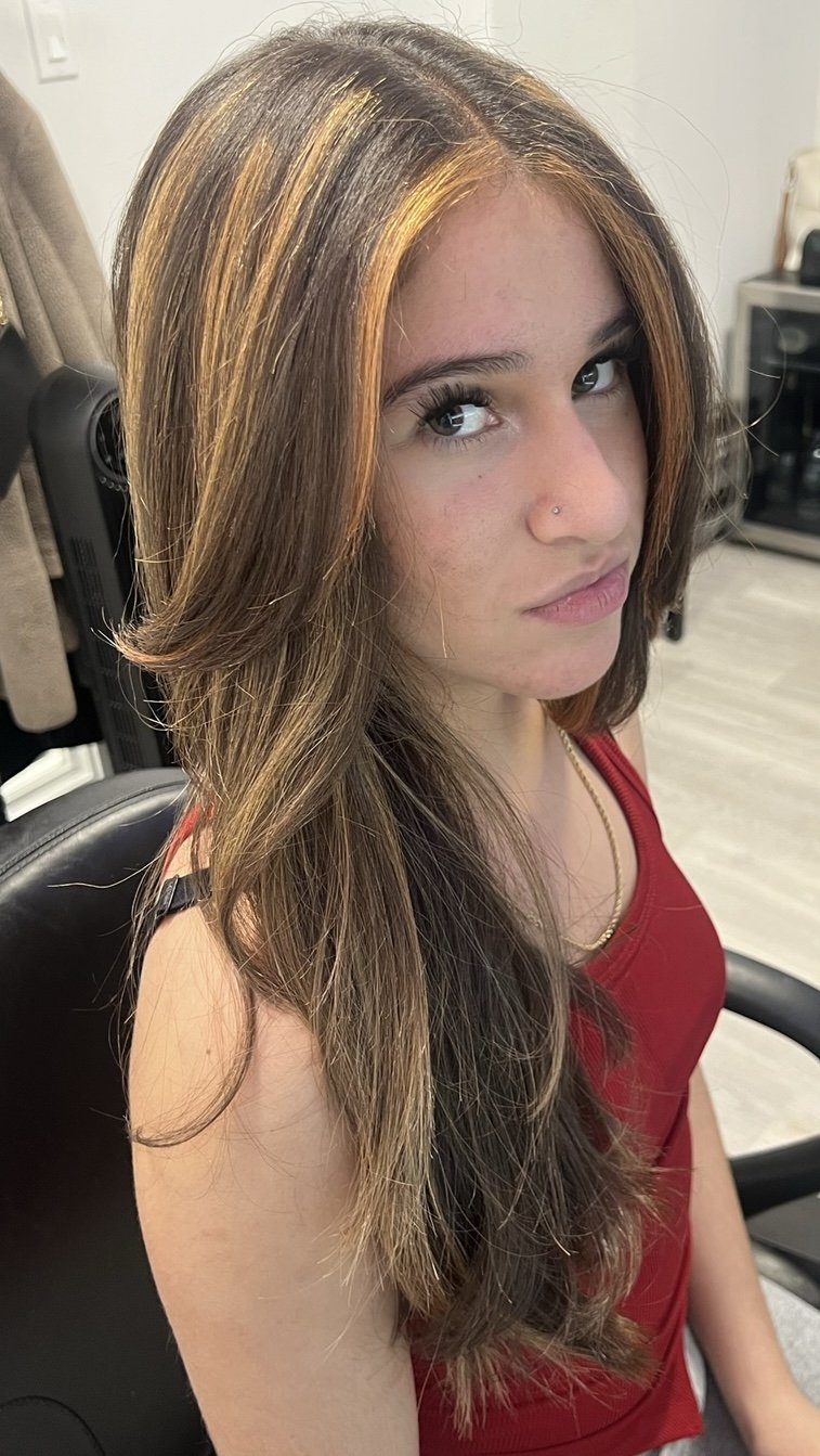 AFTER- refreshed long layered haircut, copper toned ribboned highlights with a strong money piece