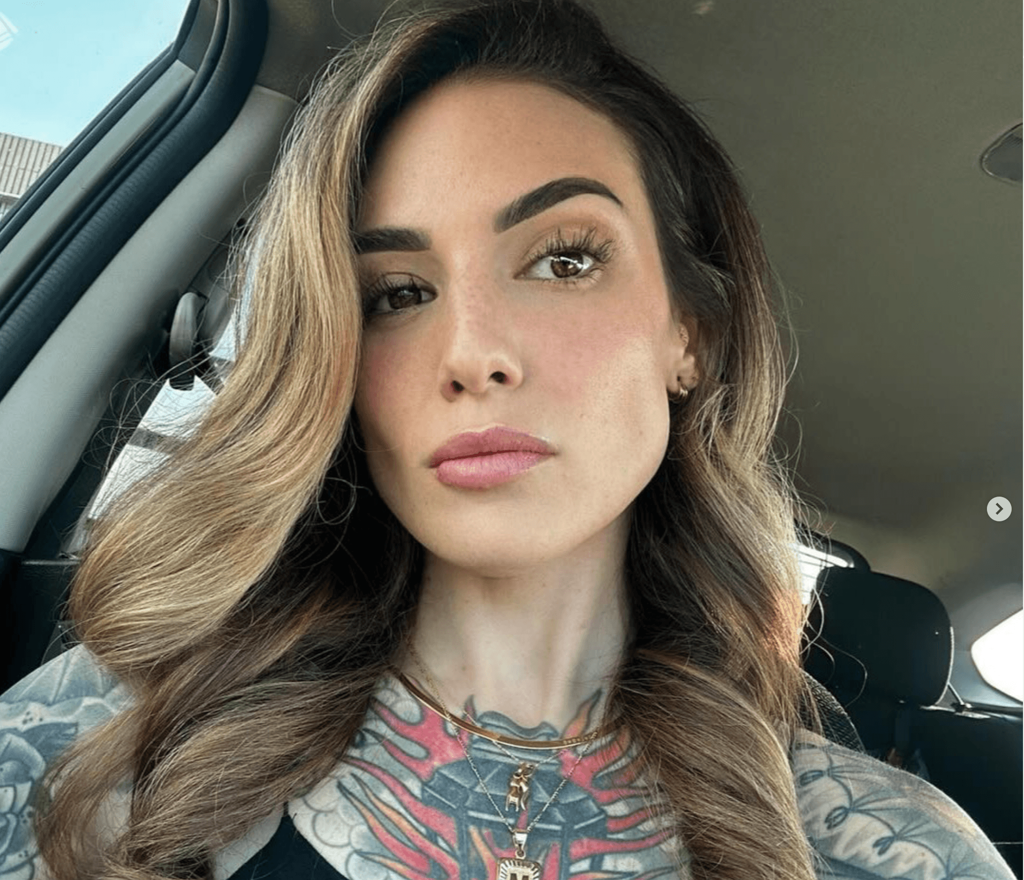 Portrait of a tattoo artist at Bombshell Suites in Bedford NH