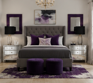 A bedroom featuring a gray upholstered bed with purple pillows, two white nightstands with black lamps, two purple ottomans, and a purple and white abstract wall art.