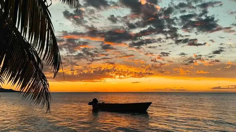 Nukubati Fiji boat on the water at sunset
