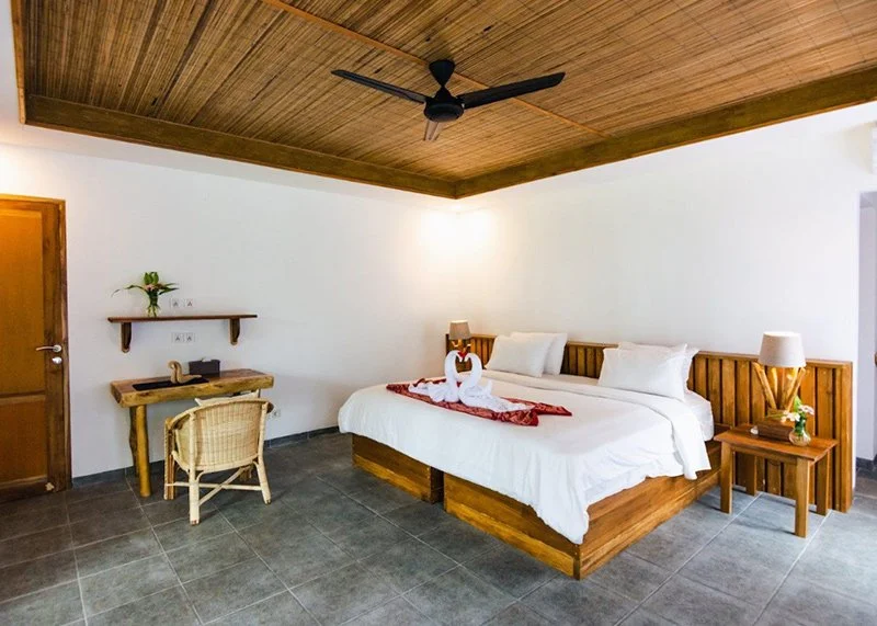 Luxury beachfront villa at Murex Manado Resort surrounded by tropical gardens in North Sulawesi, Indonesia