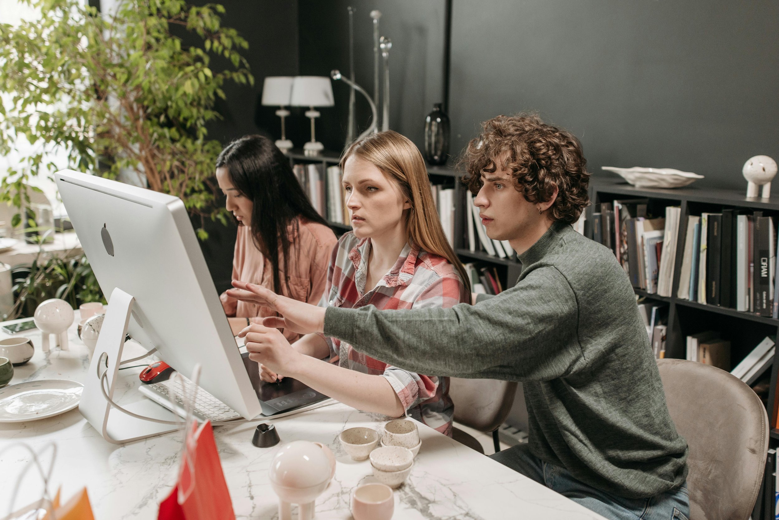 Man and women look for information on a computer