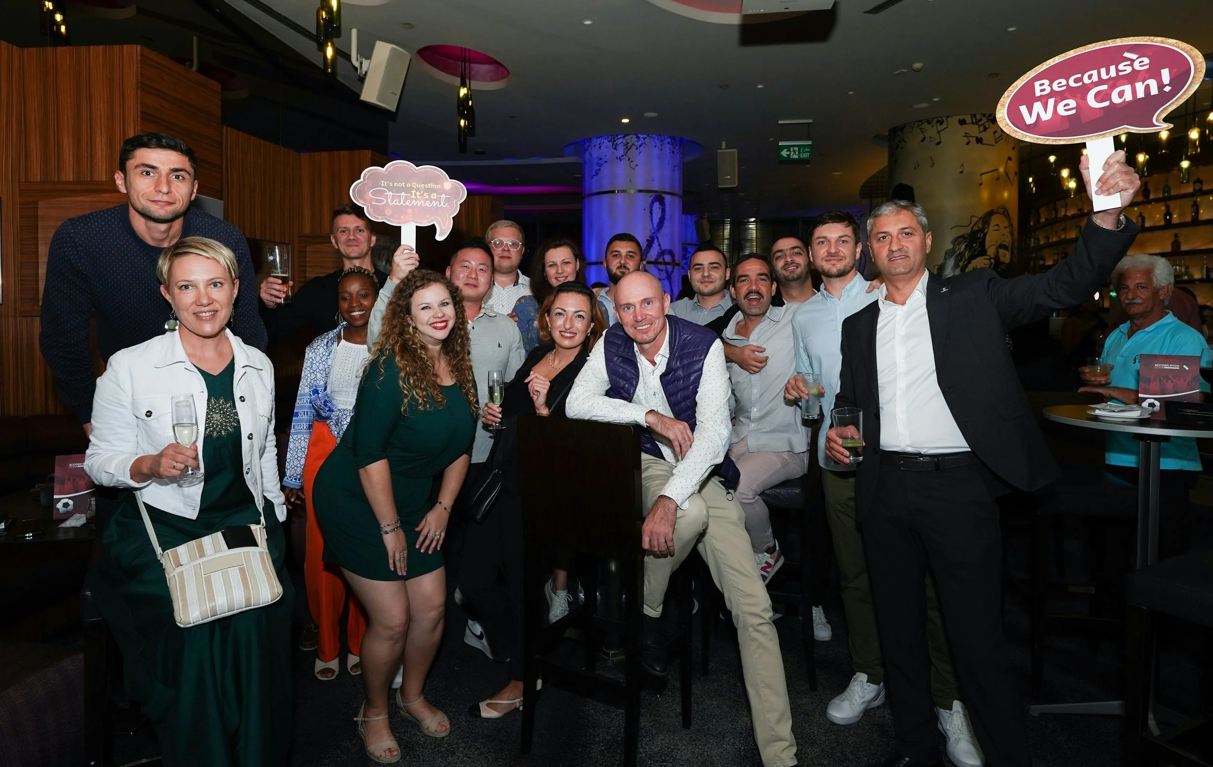 Corporate team posing at company party to celebrate Employee Engagement