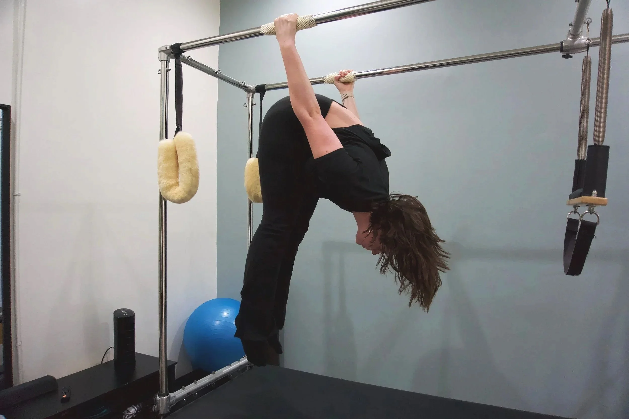 student hanging upside down