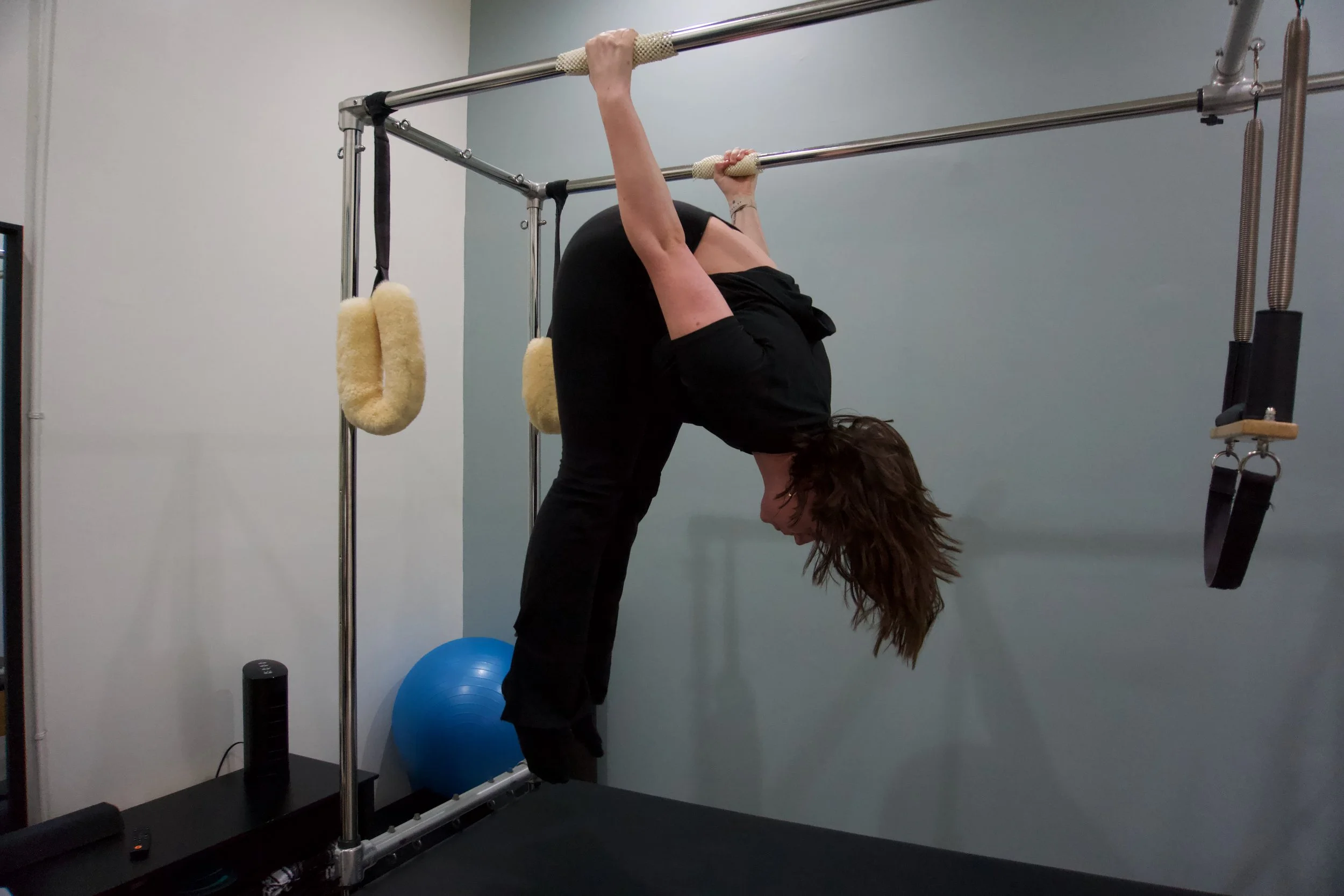 student hanging upside down