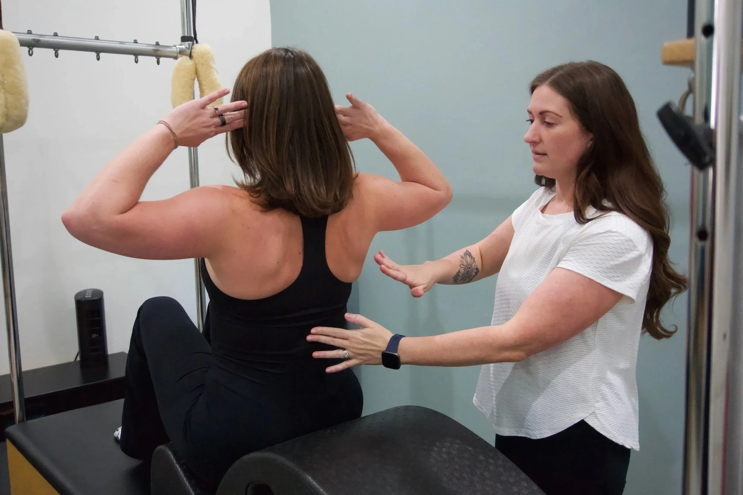 smiling women doing pilates
