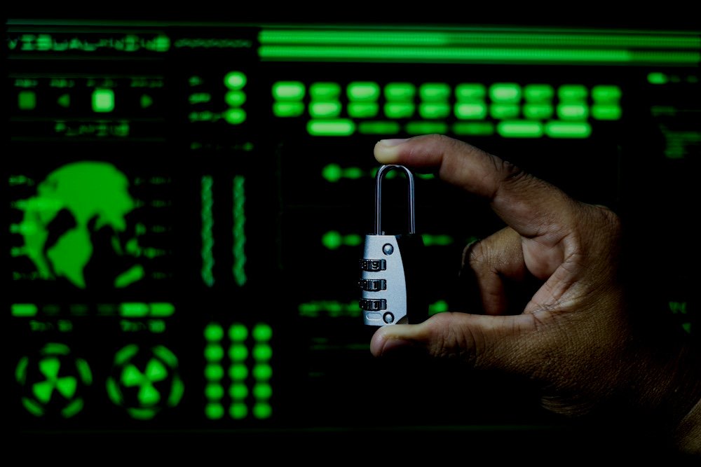 cyber-security-concept-hand-with-a-padlock-on-th-2023-11-27-04-52-47-utc.jpg