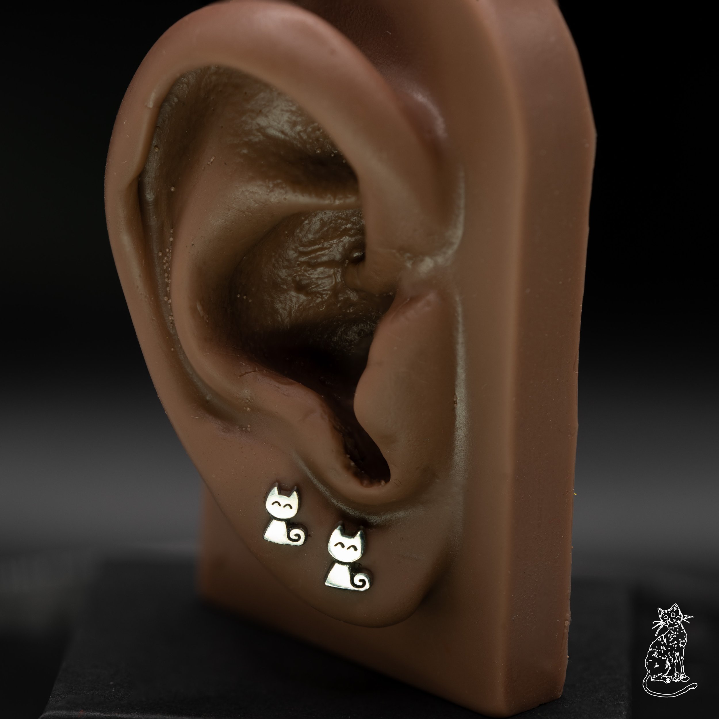 cat curled tail on ear.jpg