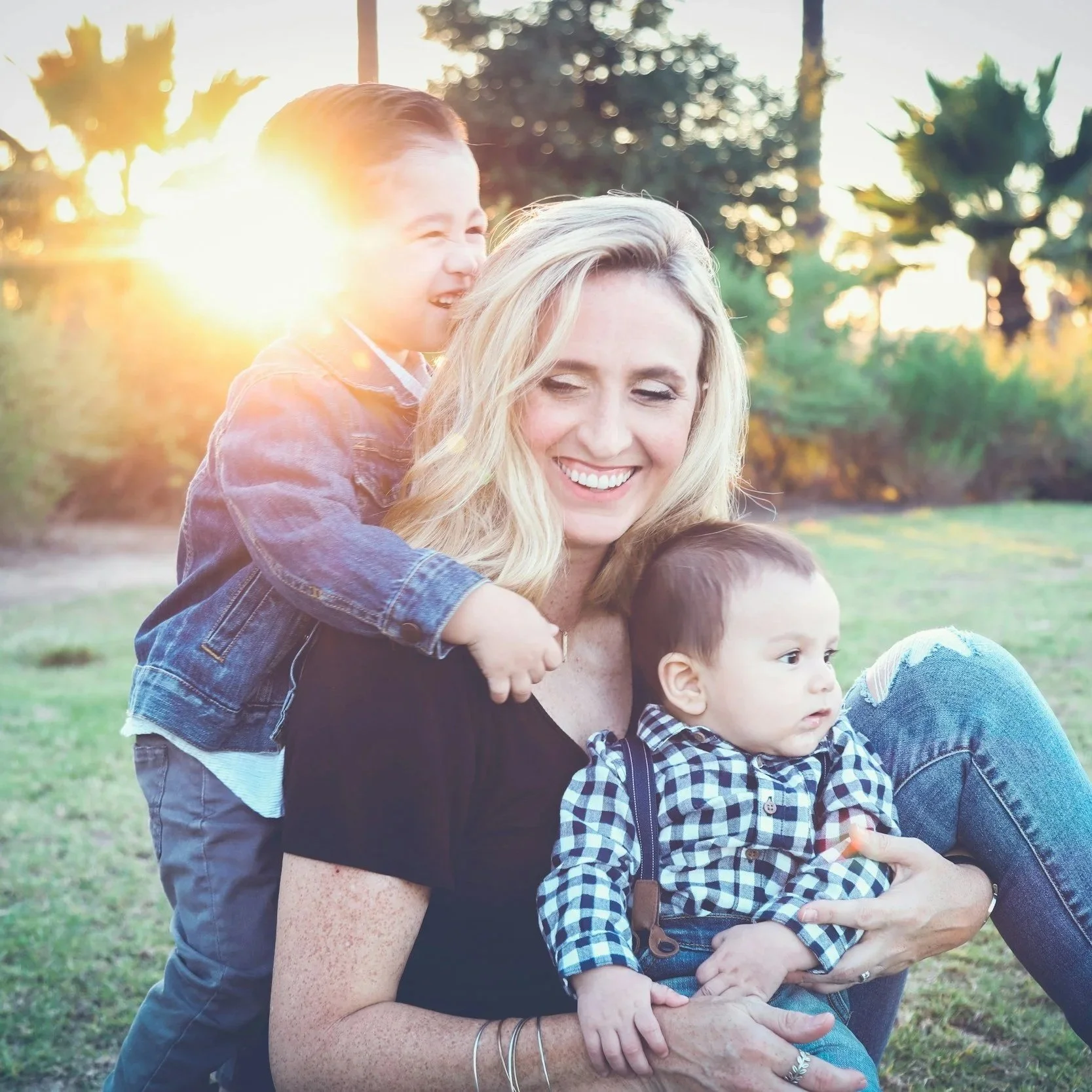 Mother playing with two sons.