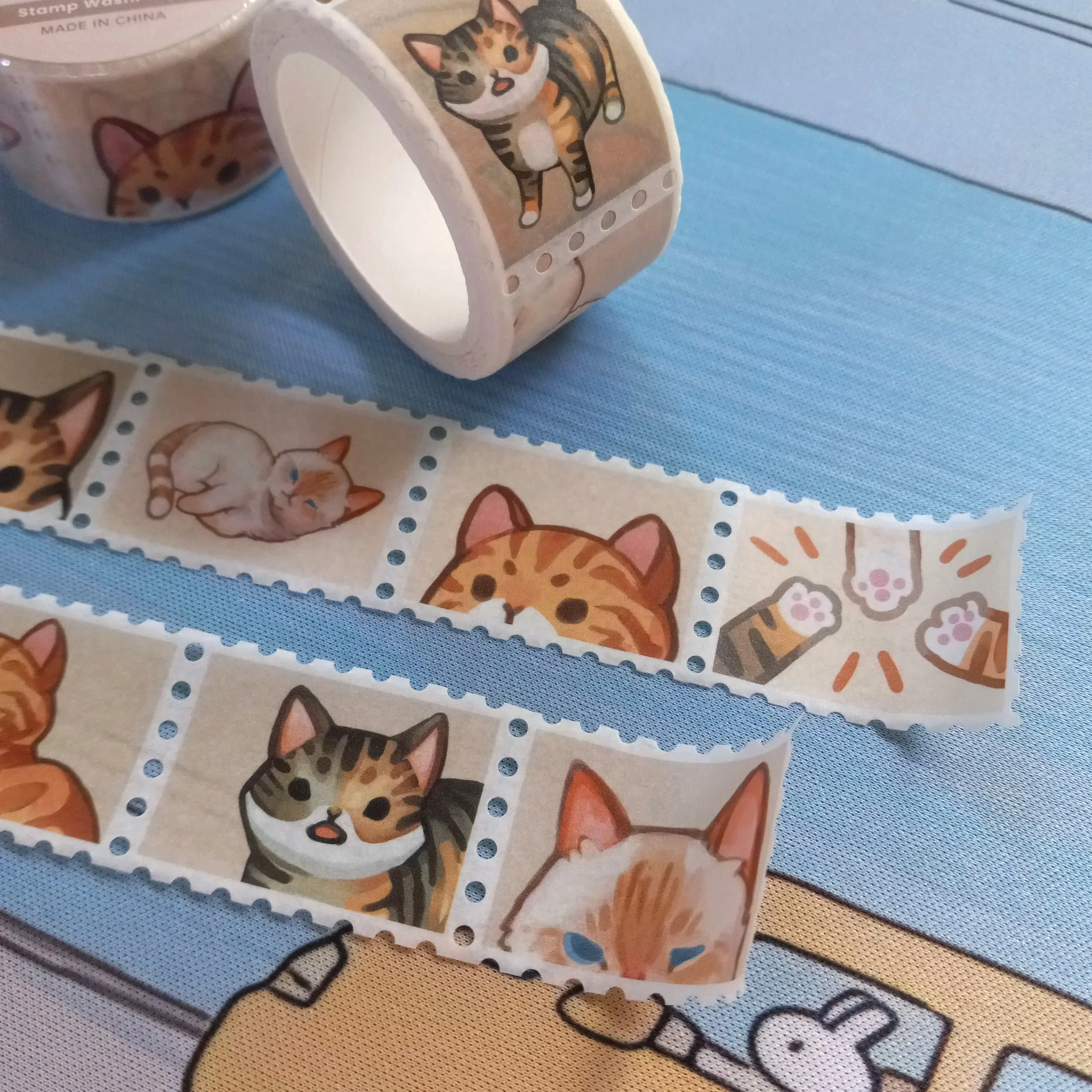 Detailed close-up of “Tabby Cats” stamp washi tape roll with whimsical repeating cat illustrations