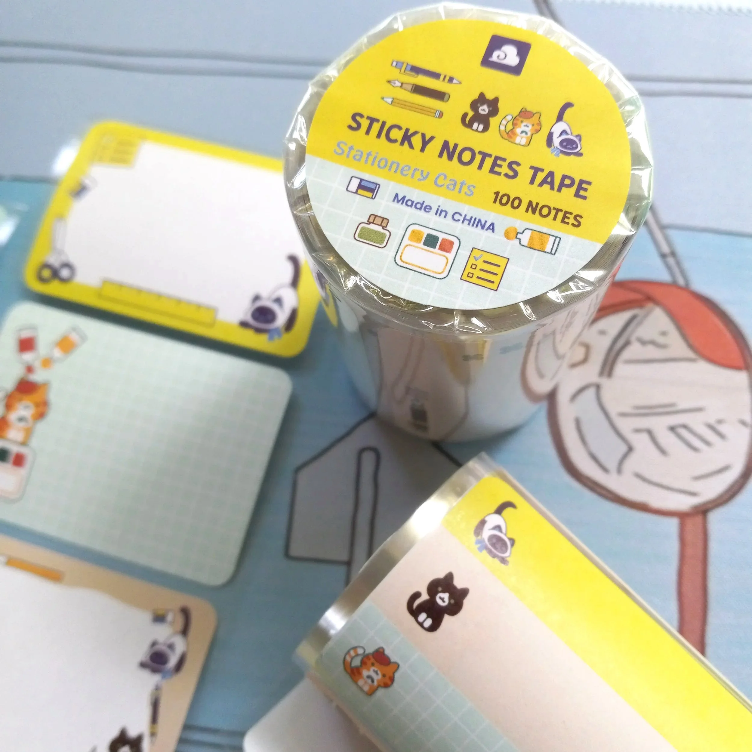 Close-up of “Stationery Cats” paper roll labels showing detailed cat illustrations with stationery elements